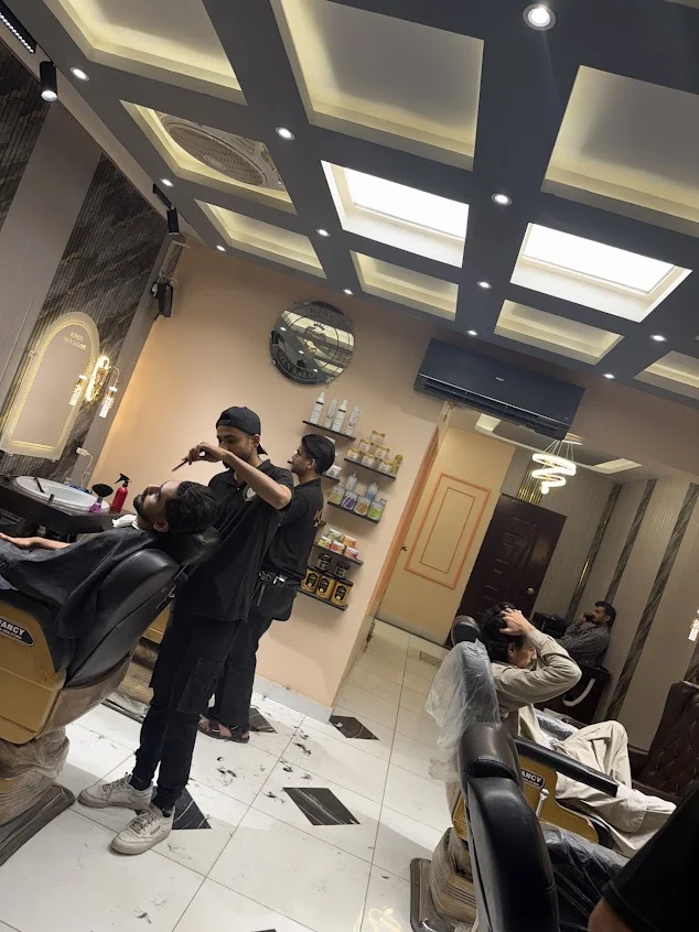 Barbers at work inside Kings Men Salon