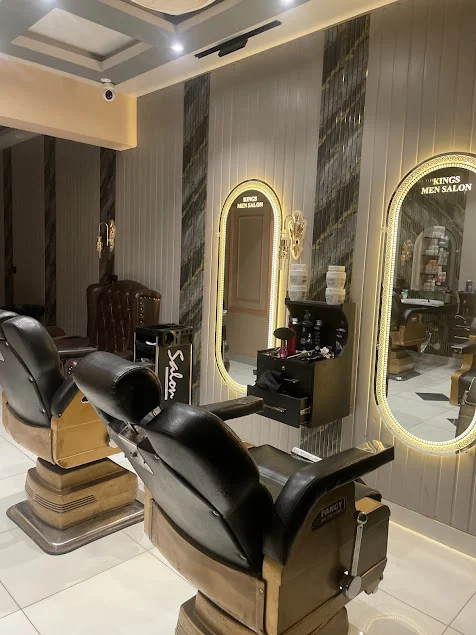 Gold mirrors and barber chairs at Kings Men Salon